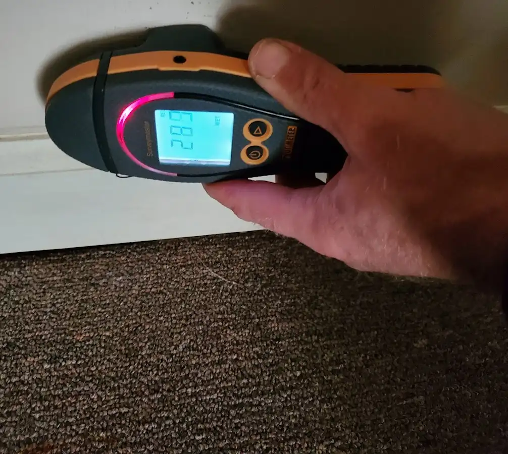 Moisture detection at baseboard during Storm Damage Restoration in Brentwood